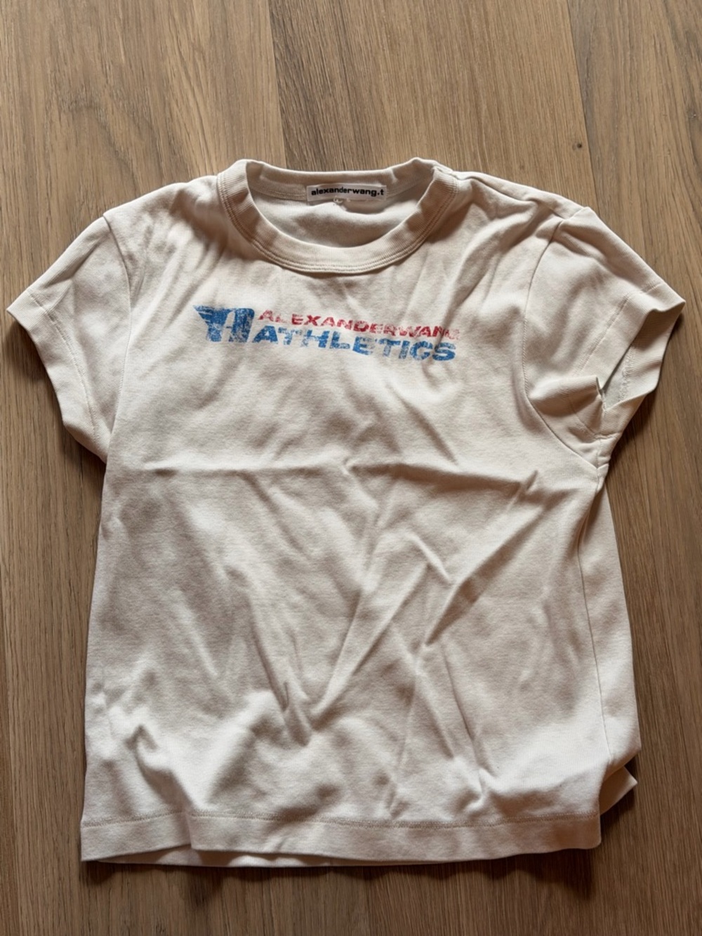 Alexander Wang Athletics Graphic Tee in Off-White with Blue & Red Logo
Size xs